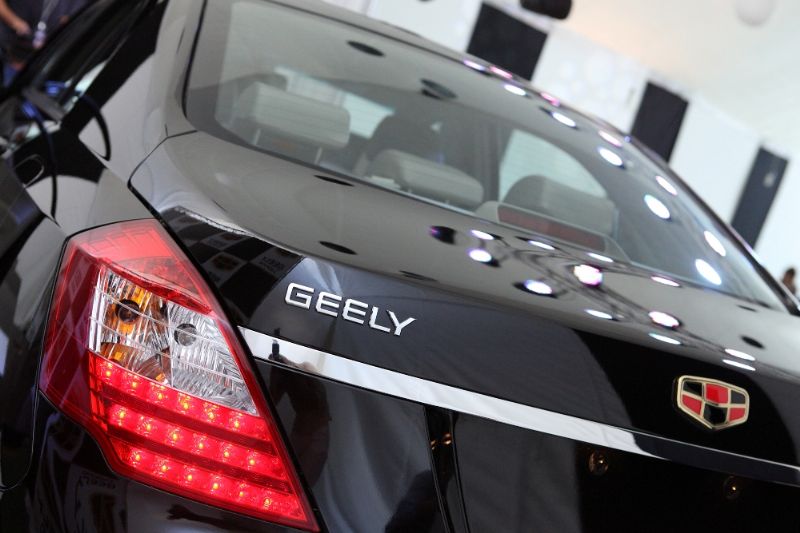 Значок geely и cadillac